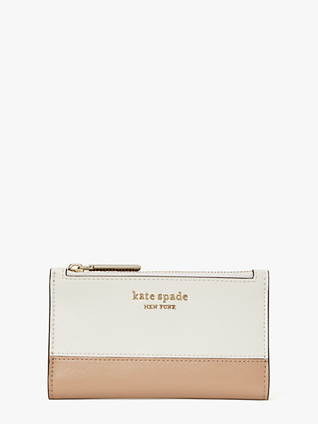 Kate Spade Spencer Small Slim Bifold Wallet In Parchment/raw Pecan